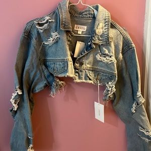 CELLO cropped distressed light wash jean jacket.
